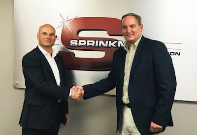 Holger Beckmann, president and CEO of Krones, Inc. and Brian Sprinkman, president of W.M. Sprinkman LLC