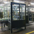 The case packer handles up to four cases per minute, which equates to 30 napkin packs per minute at 500 napkins per pack.