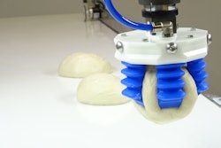 The dough production line employs four robots and relies on 3-D vision sensing at the start of the conveyor system to aid the robotic pick- and placing- of various pizza dough sizes.