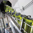Printed cans are depalletized and run through a twist rinser prior to filling and seaming.