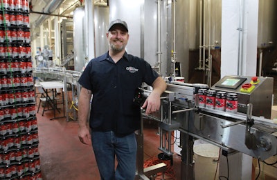 Jesse Pittman, head brewer, uses an in-line labeler to overwrap printed cans for small-batch runs requiring labels. When using higher volume printed cans that don’t require labels, the filled cans pass through the machine unaffected.