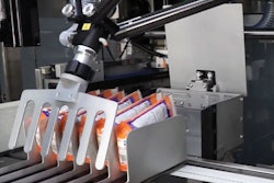 Robotic end effector sweeps six bags into one of the Adabot’s two loading buckets.