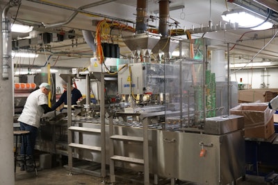 Crest Foods’ newest cup filling line is anchored by a volumetric cup filler and four auger fillers.