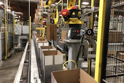The robotic partition inserter includes four robots in all: three to place the partitions, and one to tamp them down.