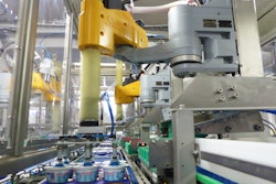 A SCARA robot picks six tubs of dairy product from a conveyor and places them into a corrugated tray.