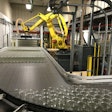 At a speed of 2.5 layers/min, the robot picks a full layer of jars from a pallet and places it on the filling line infeed.