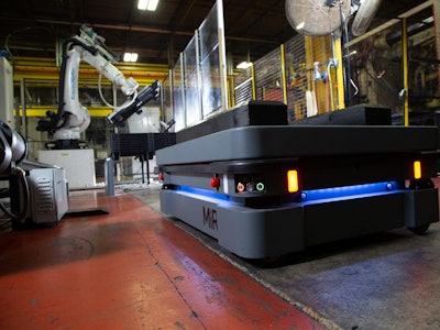 The MiR500 robot approaches the injection molding machine and its attendant robot.