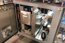 Wheeled, hinged electrical cabinet is on rails, making for easy maintenance access on the 500 bag/min machine.
