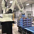 With new end-of-arm tooling designed by Caxton Mark, the Kawasaki palletizer is able to grab and stack boxes without crushing the fragile tomatoes inside.