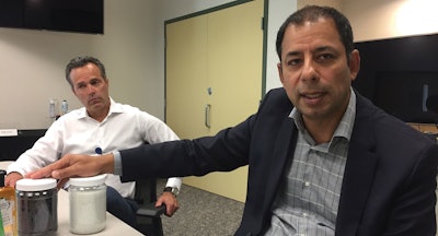 At Beckett Ridge Technical Center, Victor Aguilar, Vice President Corporate Technology Development and Open Innovation, shows how clean and white polypropylene flakes are once they’ve gone through the PureCycle process. Looking on is P&G Research Fellow Ken McGuire.