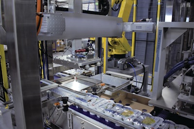 A high-speed linear gantry replaced the delta-style robot commonly used by Nuspark in tray-loading applications like these.