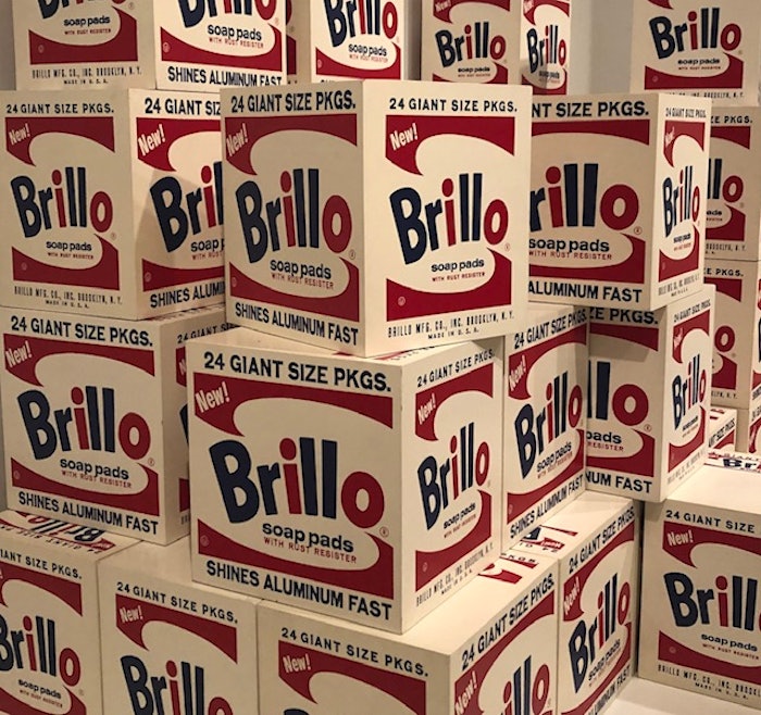 Brillo sculpture from 1964 not only pays homage to beautiful package graphics, the Brillo boxes were produced in a 'factory' and displayed like products on a store shelf.
