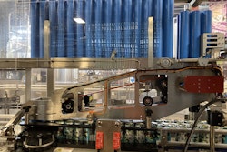 A notable feature on the CCA440+ plastic carrier handle applicator is the overhead carrier queue. It lets an operator load up multiple stacks of carriers in one go and then turn to other tasks as the carriers are methodically conveyed into the feed station.