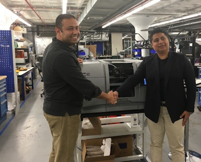 Fady Saad (left), MassRobotics Co-founder, receives the Festo delivery of a Rize 3D printer for the MassRobotics Shared Labs from Festo Senior Product Manager Nuzha Yakoob.