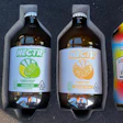 Like almost all of Spacestation’s beverage output as a copacker, the company’s own Flybeverage brands—Nectr and Uncle Arnie’s—use a shrink sleeve labeling system that is flexible enough for a variety of different combinations of bottle dimensions/heights, substrates, container transparency levels, and closure styles.