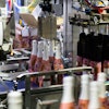 Smooth handling of bottles and partitions is a hallmark of the Wrap-Around case packer.