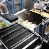 The Spider 200i from BluePrint Automation uses a multi-axis robot to pick snack bags on-the-fly and vertically case pack them into a cassette that forms a vertical pack pattern.