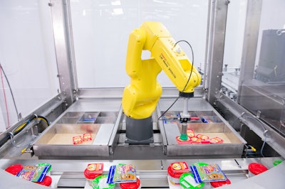 At PACK EXPO Las Vegas in fall 2019, Syntegon’s Pack 102 horizontal flow wrapper with three Fanuc robots was demonstrated loading meal kits.