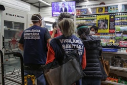 RIO DE JANEIRO, BRAZIL - JULY 03: Health Surveillance Inspectors with the support of the Municipal Guard inspect bars and restaurants amidst the coronavirus (COVID-19) pandemic on July 3, 2020 in Rio de Janeiro, Brazil. The agents stepped up their operations after reports of agglomeration and non-compliance with security rules during the easing and reopening of commerce in the city of Rio de Janeiro.(Photo by Andre Coelho/Getty Images)