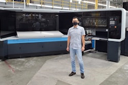 K-1 President Mike Tsai in front of the Landa S10 Nanographic Printing® Press