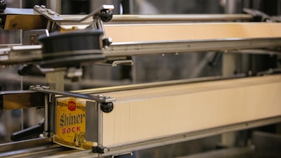 A magazine of die-cut labels await their bottle. All the beers produced at Spoetzl use vintage cold glue labels instead of p-s as a tip of the cap to the classic bottled beer format.