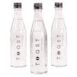 The sleek, 16.9-oz, clear wine-bottle shaped package uses minimal decoration, with the logo positioned in black type vertically up the front panel of the bottle.