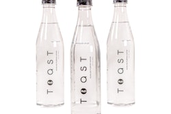 The sleek, 16.9-oz, clear wine-bottle shaped package uses minimal decoration, with the logo positioned in black type vertically up the front panel of the bottle.
