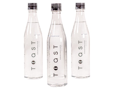 The sleek, 16.9-oz, clear wine-bottle shaped package uses minimal decoration, with the logo positioned in black type vertically up the front panel of the bottle.