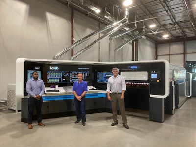 Duggal CEO and colleagues with Duggal's new Landa S10 press.