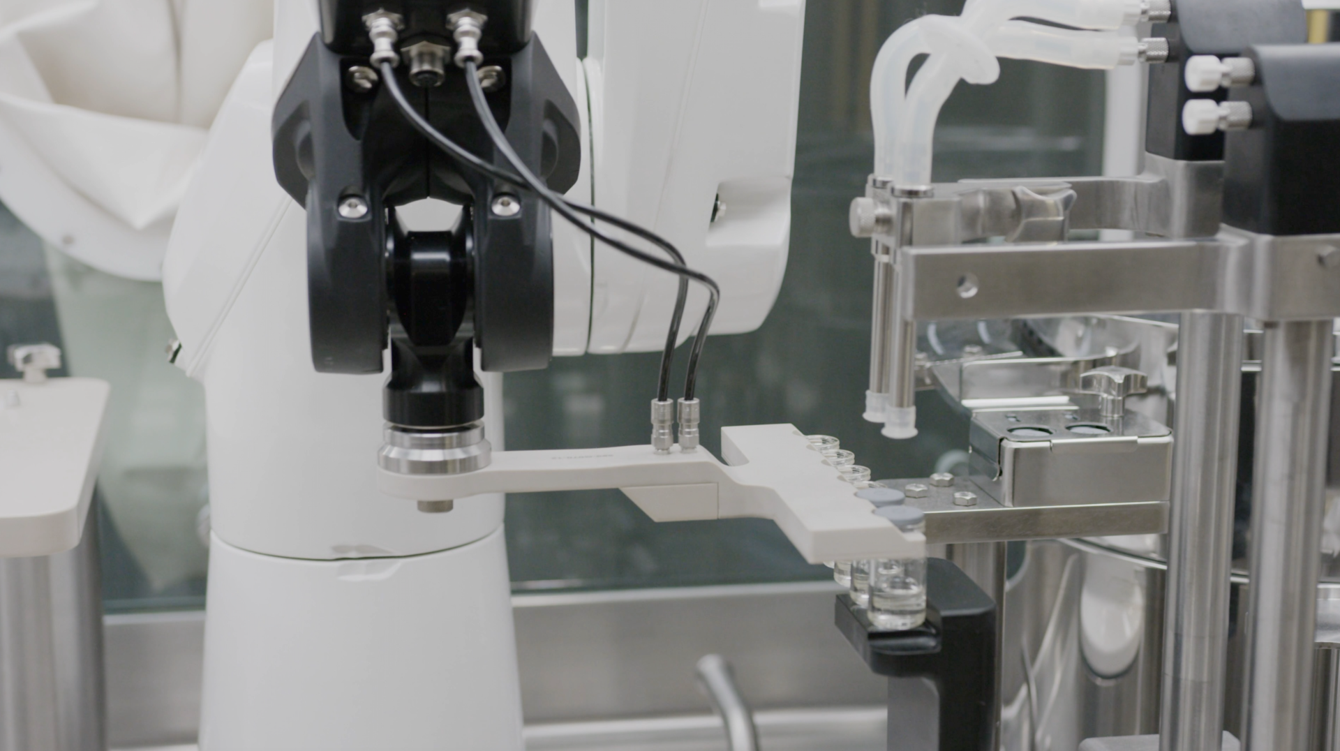 A St&auml;ubli TX2 series Stericlean robot presents vials for secure stoppering with reliable repeatability and no risk to the aseptic environment.