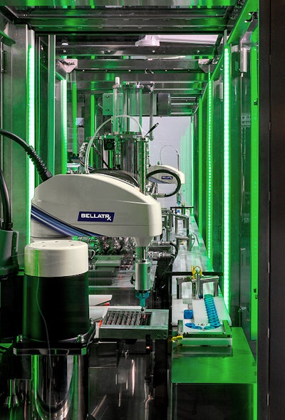 Robotic pick and place stations unload vials from trays into pucks that index the tubes gently throughout the process.