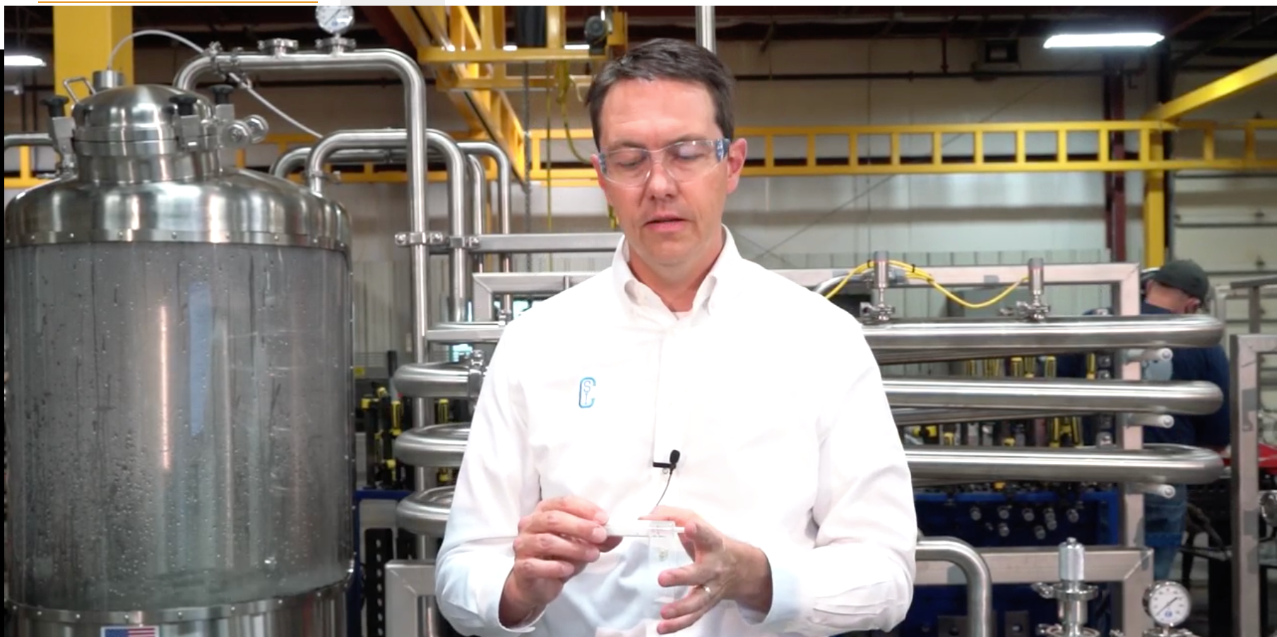 Eric Gore, technical director at Central States Industrial, demonstrates the creation of bubbles forming in a syringe when the plunger is pulled back (lowering the pressure in the system).