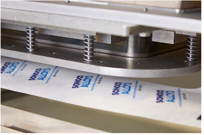 Sealing and diecutting happen at once. When the tray fully engages into the machine, the Tyvek indexes, and the heat platen automatically comes down to seal and cut the Tyvek in the customized shape.