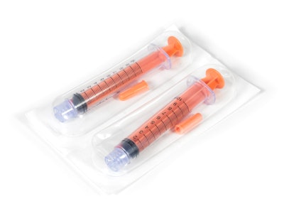 Medical syringe in flexible thermoformed packaging.