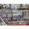 The 14-station rotary filler runs at a steady 35 bottles/min when 750-mL bottles are in production.