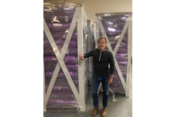 Flopak Managing Partner, Mike Greene, inspects pallets of floral wrap shipped with the patent pending Paklite™ Shipping System.