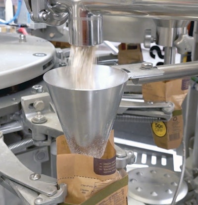 Photo shows a package paused as it receives its charge of oatmeal.