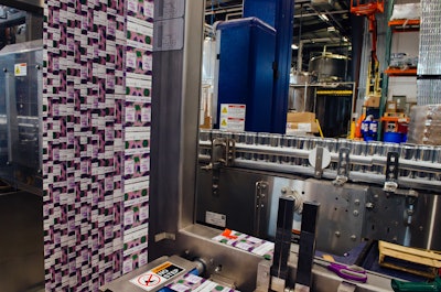 A sleeve labeler from Krones applies labels to brite cans.