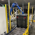 The robot places lids on the containers of preforms at a speed of 45/hr.