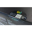 A holographically printed, tamper evident label with external QR code and die-cut tear strip spans the gap between shipper sidewalls and top.