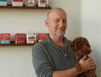 Pawel Marciniak, co-founder and President of NaturPak Pet, with family pet, Coco.