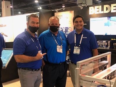 Chris Noble and Ray DiVirgilio of Belden with Glenbrook South student Costa Aralis at PACK EXPO Las Vegas 2021.