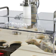The tare gross weighing system accounts for variable-weight glass jars by weighing the empty jar, filling the jar with cannabis flower, weighing the filled jar, and finally validating the contents’ weight by comparing the feeding scale weight with the post-fill scale weight.