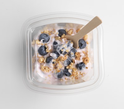 Beyond traditional retail requirements, both convenience store and airline customers—key target markets for these berry parfaits—required these packs to include a wooden spoon in the overhead space, which rests alongside the flow-wrapped granola.