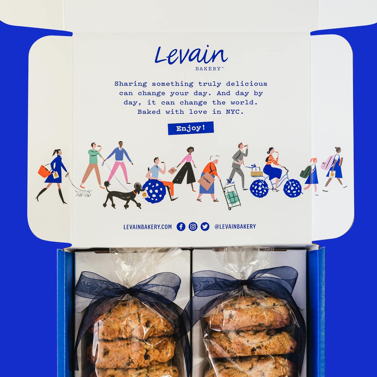 Levain Bakery’s e-comm packaging features a “cookie lover’s parade” illustration that includes a variety of characters of different ages, abilities, ethnicities, and genders.