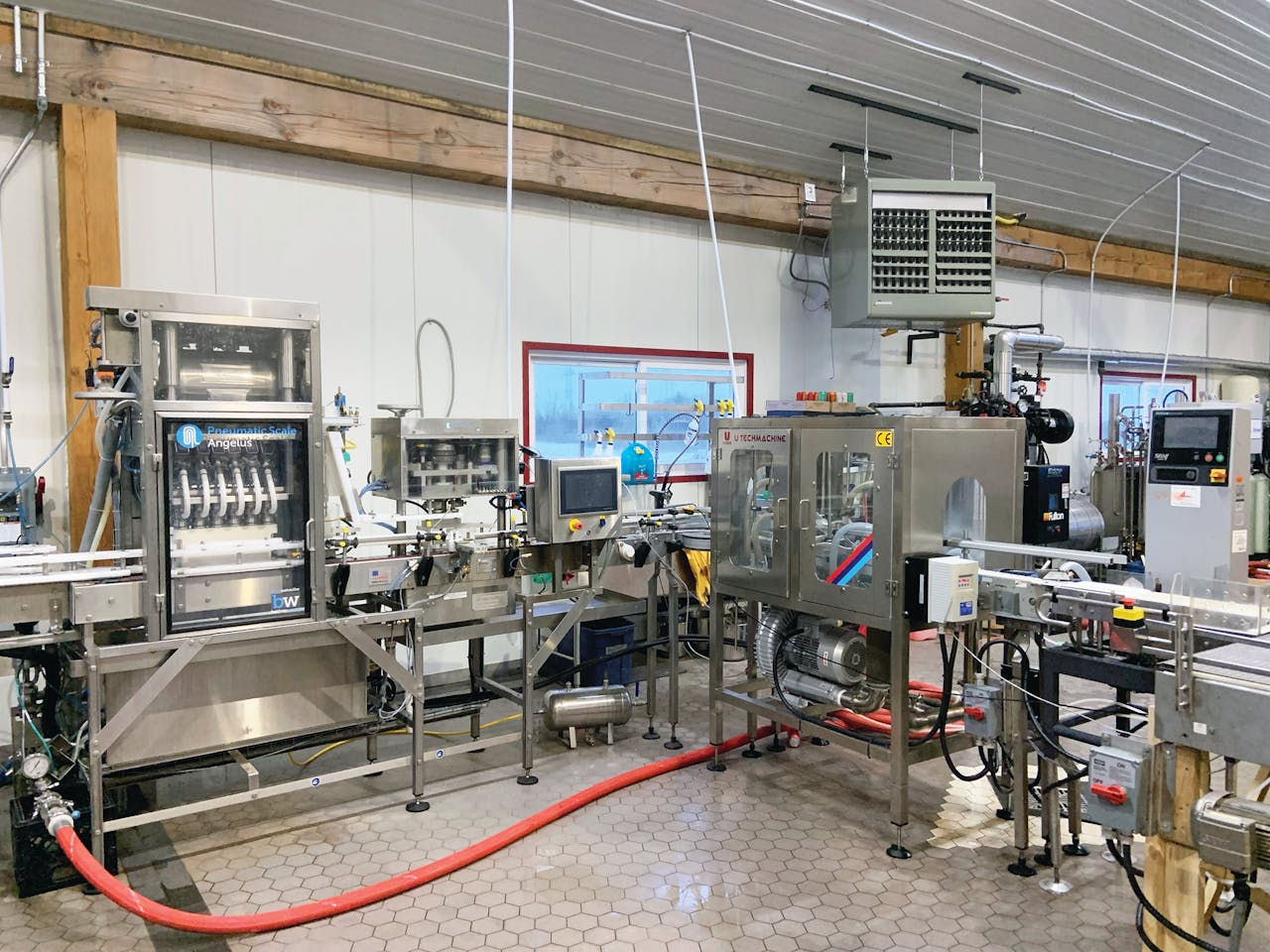 Downstream of the filler and seamer is an air rinser