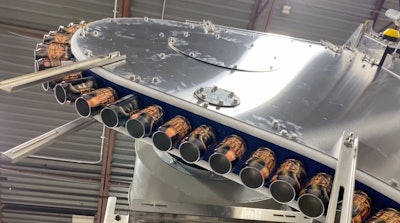 Vacuum conveyor transfer also helps bring finished cans up to the palletizer.