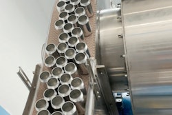 Juno makes good use of vacuum conveyor transfer to bring unprinted cans down from the overhead depalletizer.