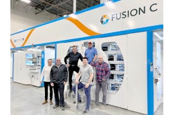 Aspen Press & Packaging team members show the installed Fusion C flexographic printing press from PCMC.