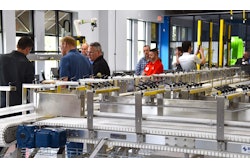 ROBEX sales engineers demonstrate an automated assembly line to prospects.